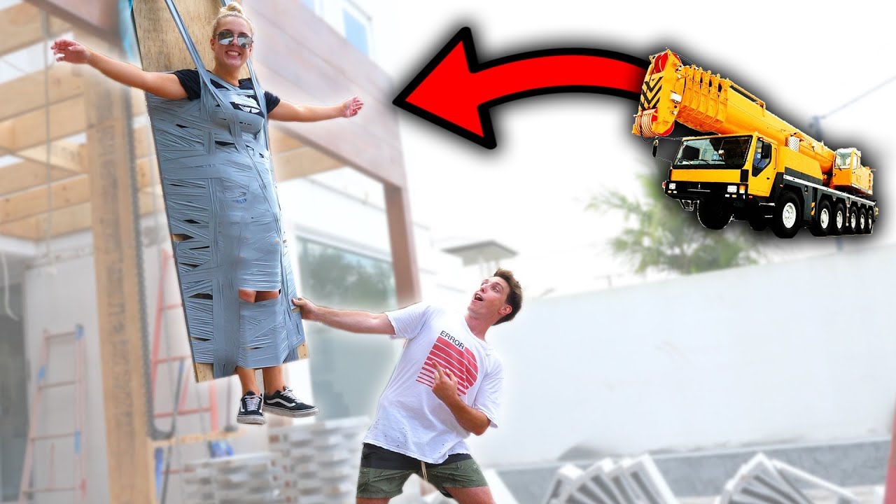 DUCT TAPING MY SISTER TO A CRANE!