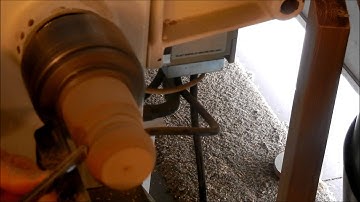 Wood turning a handle to a Crock Pot lid.