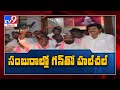 TRS leader Kattela Srinivas hulchal with gun in Telangana Bhavan