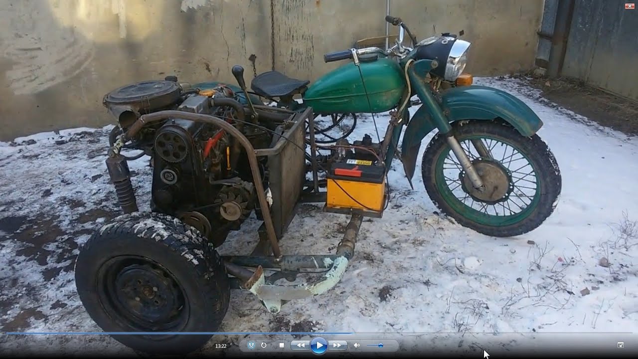 A HOMEMADE motorcycle with an engine from a car mounted in a side
