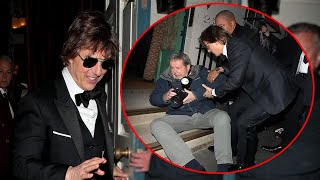 Tom Cruise stopped to help up a photographer who crashed to the ground at at Victoria's birthday