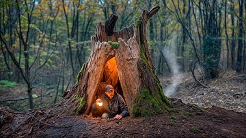 Een warme en gezellige geheime schuilplaats bouwen diep in een grote boom Bushcraft Survival Dugout.