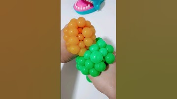 squishy balls 💚🧡 #viral #squish #squishy #satisfying #stressball #popular #trending #shorts #asmr