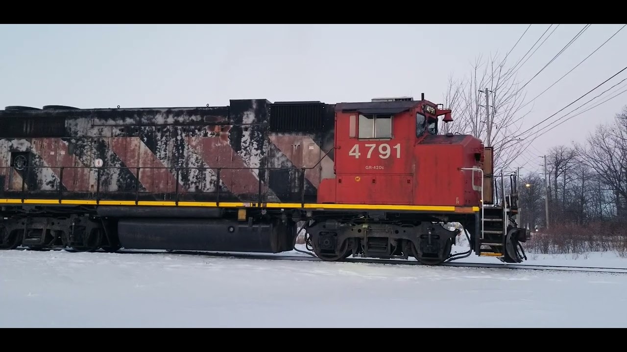 CN L551 EMD GP38-2W 4791 & GP38-2W 4796 are switching Tracks in The Glasslead Industrial 