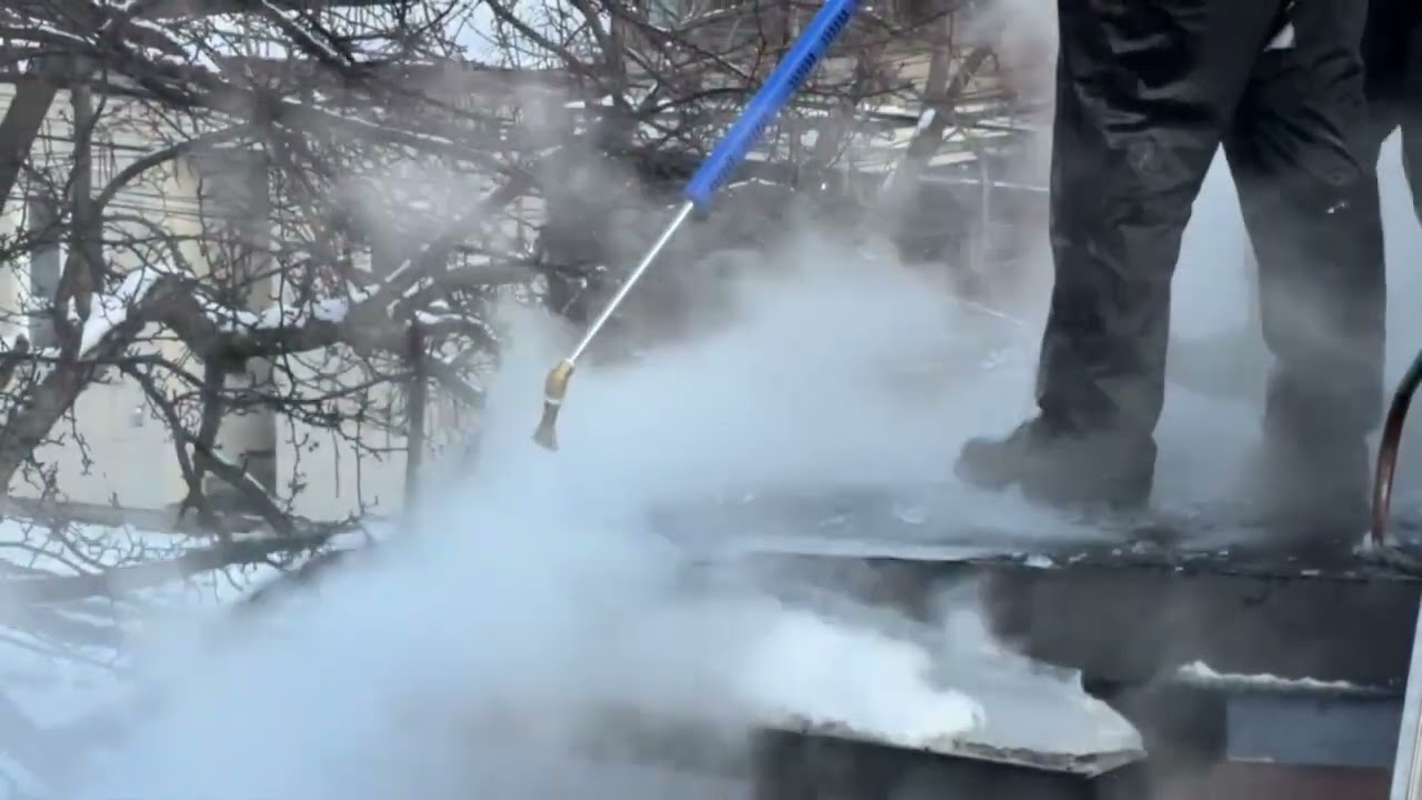 Clearing Heavy Ice from a Downtown Flat Roof | Bronson Johnson Seamless Eavestroughs