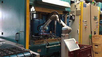 Robot automation in Compression Rubber Moulding by Betech A/S