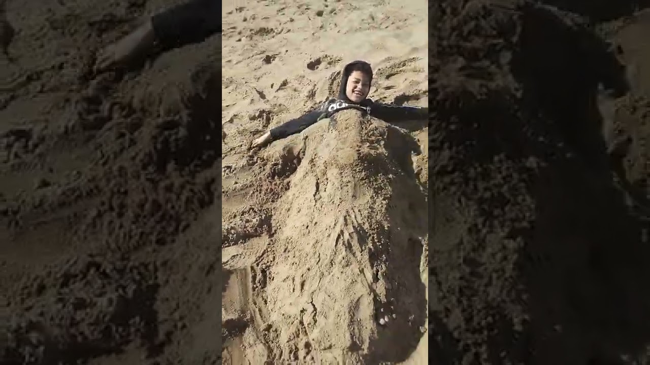 covered in sand call me Mr Sandman