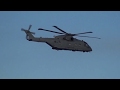 full size military helicopters fly over