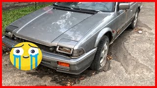 Abandoned old Honda Prelude. Abandoned vehicles in the city