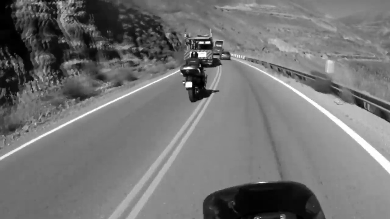 Ananova - Quick-Thinking Biker Dodges Lorry Overtaking On Bend