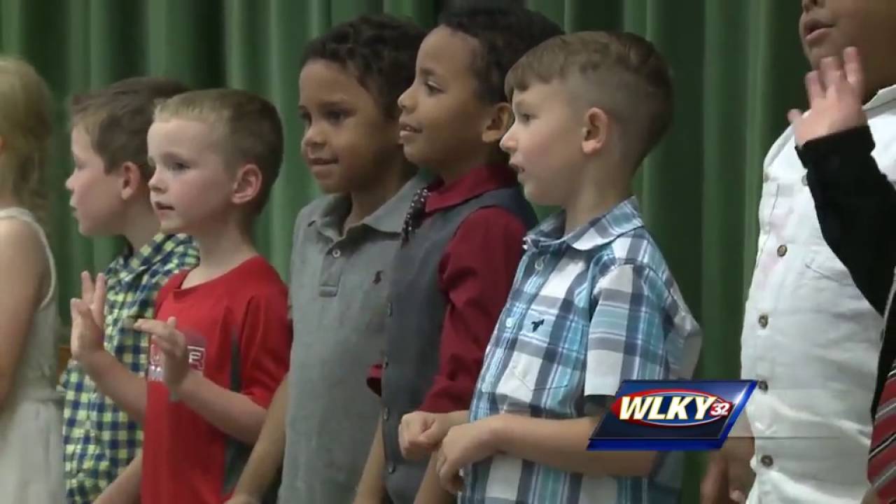 Marine surprises son at kindergarten graduation