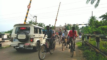 Randomly public Passing Railgate Gateman Redy to close Railgate High Speed Train Comeing Quickly