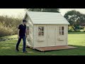 Kids outdoor playhouse assembly by whole wood playhouses