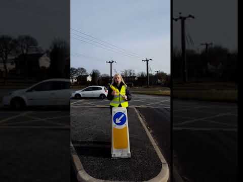 TDY - Tour Makers: Example of directing the riders either left or right on a traffic island