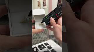 Testing A Moissanite Engagement Ring With A Diamond Tester