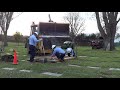 lowering casket into grave