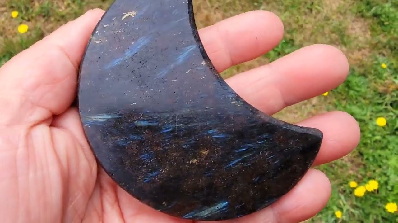 Gemstone Fireworks Garnet With Inclusions Of Blue Arfedsonite  And Or Astrophyllite Shimmers