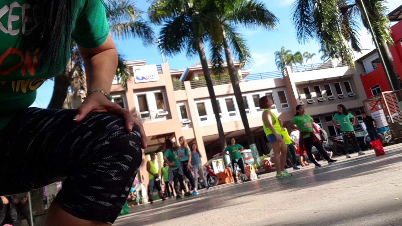 Zumbaranggay in green 1 dancing in the street