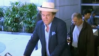 EXCLUSIVE - John C. Reilly And Wife Alison Dickey Return To L.A. From Cannes