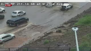 Flooding on I-25 causes car to stall out