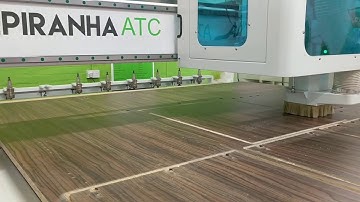 Piranha ATC CNC Producing Kitchen Cabinets in dark wood finish