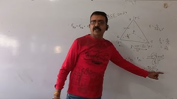 Three point charges 1 picoCoulomb each are kept at the vertices of an equilateral triangle of side