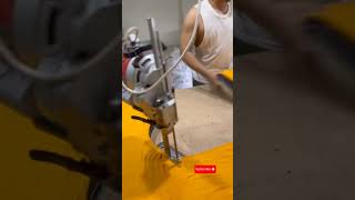 Industrial worker cutting layered fabric using electric rotary machine in textile factory #asmr