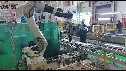 AC compressor pick and place in Assembly line.