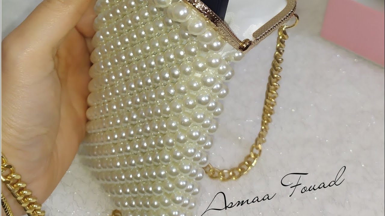 شنطة كروس(جراب موبايل)من اللولي ب فريم معدن        pearl bag