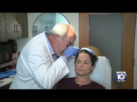 Doctors working on invasive therapy for treating hair loss
