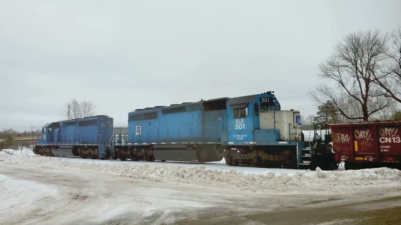 Freight Train Creating Winter Speed Bumps At Railroad Crossings! 