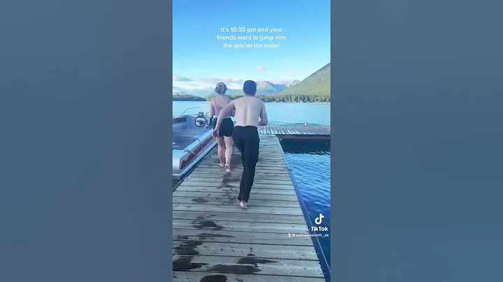 Jumping into the glacier fed water in Alaska