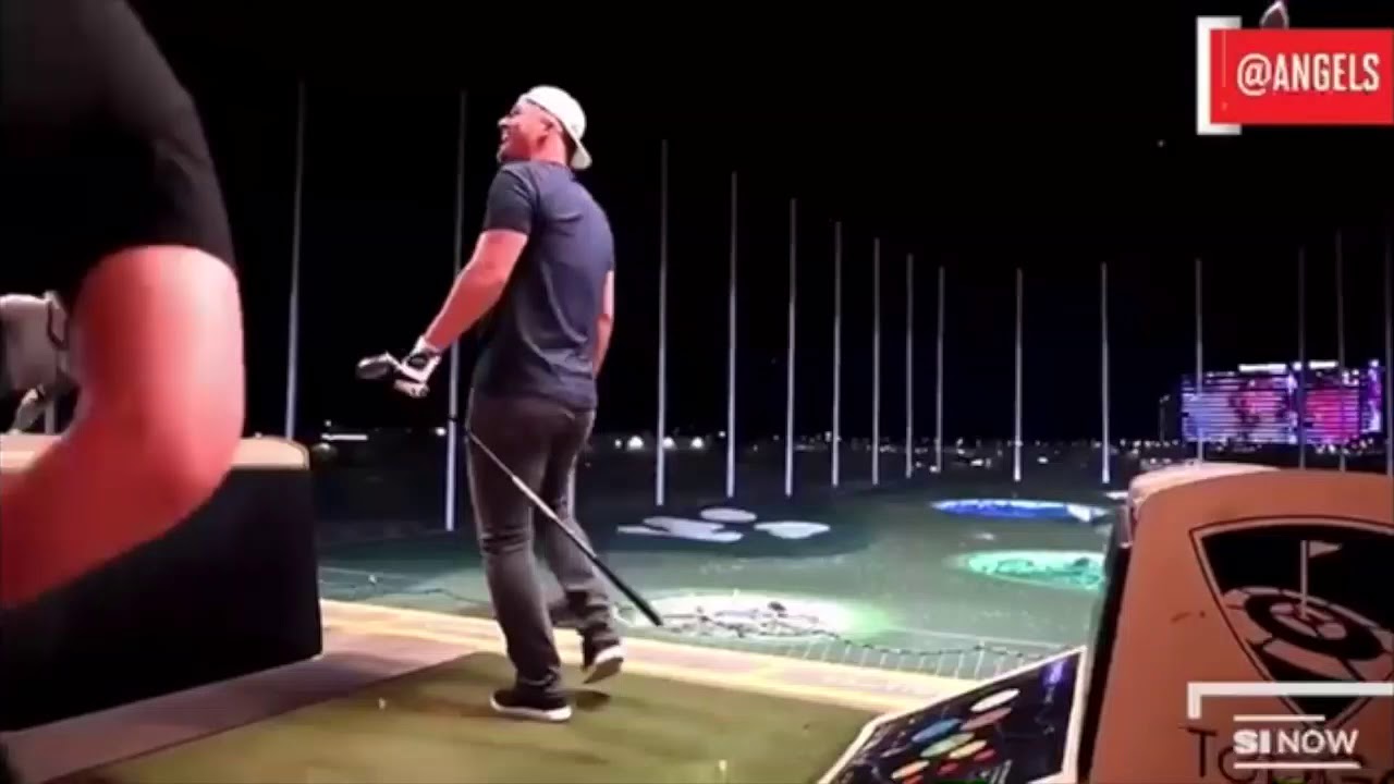 Mike Trout crushing a ball over the fence at top golf