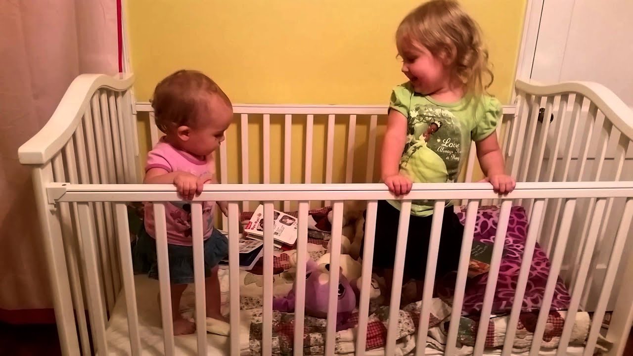 Adorable sister babies playing and jumping together in crib YouTube