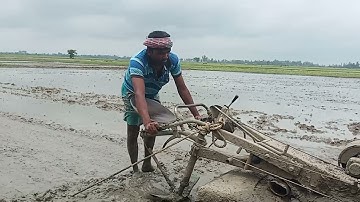 soil is level by power tiller with ladder.  Risky power tiller driving