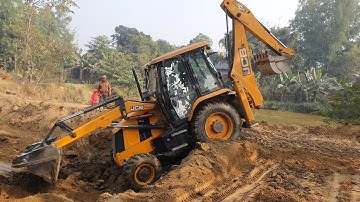 JCB Backhoe Cutting Soil and Collecting to Load in Tractor - JCB Machine Leveling Ground