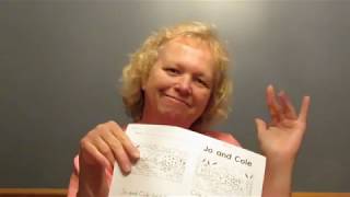 Mrs. Raeker reading The Broken Clock by Emma DeBrose