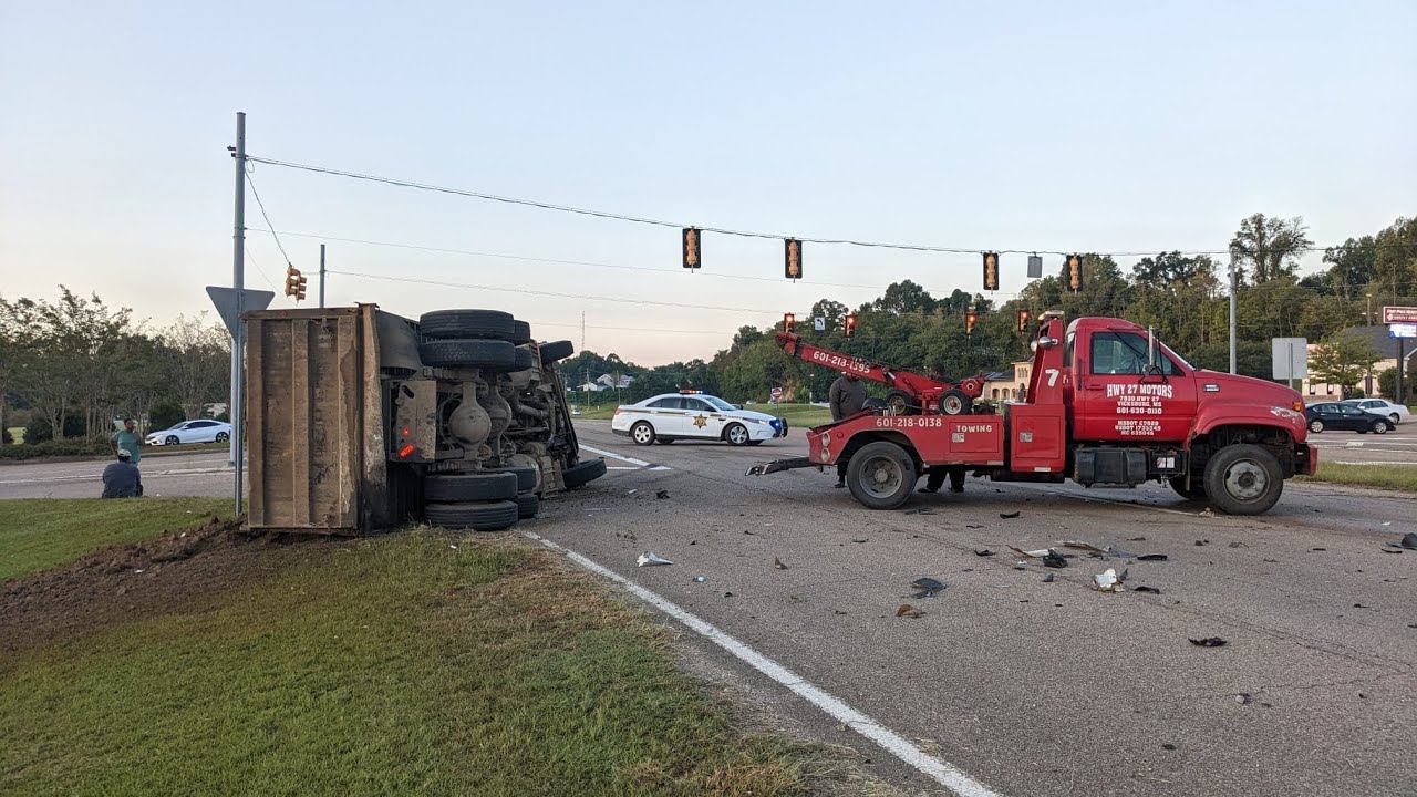 Overturned dump truck in front of River Region - YouTube