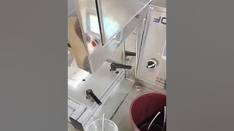 Semi-automatic candle wick inserting machine