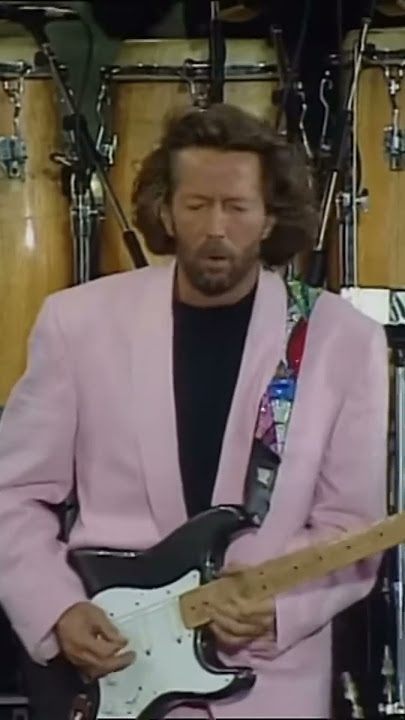 Dire Straits & Eric Clapton perform “Money for Nothing” LIVE at Knebworth (1990).