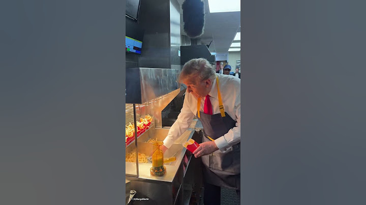 Donald Trump gets his hands dirty serving fries in McDonald's
