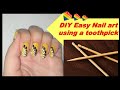 DIY nail art using a toothpick-Black and white easy nail art on yellow base-Nail art for beginners