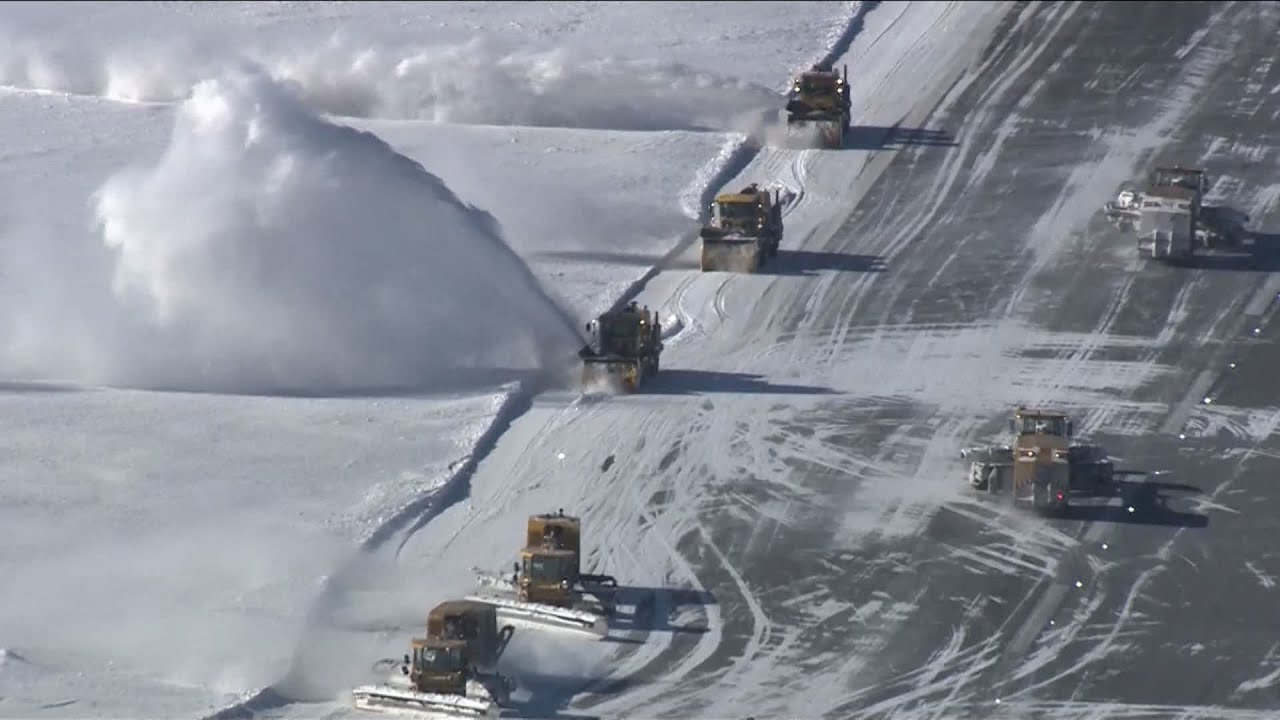 WATCH: Logan Airport's snow plows, blowers hard at work after nor'easter hits Boston, Massachusetts