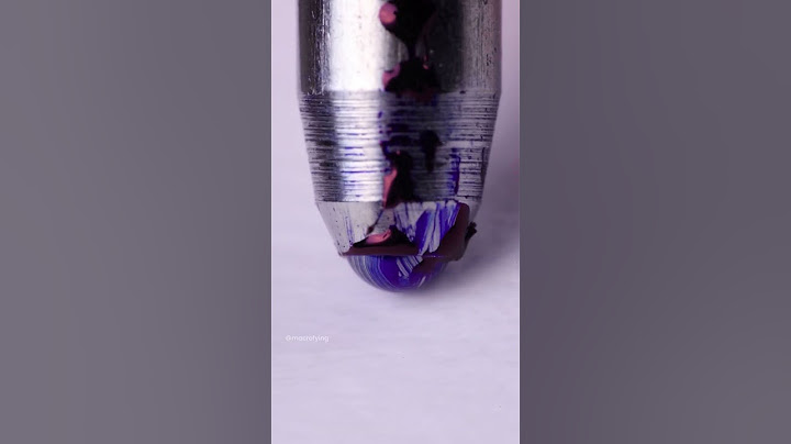 The ball of a pen loosing ink while rolling over paper.