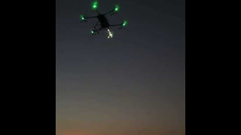 Joyance agricultural sprayer drone flying at the night