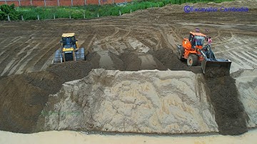 Never ever seen before bulldozer vs wheel loader use power to working plowing sand into deep water