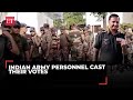 LS Elections 2024 Phase 7: Indian Army personnel stand in a queue as they await their turn to...