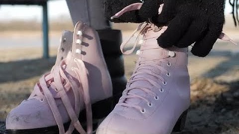 Tying Ice Skates Stock Video