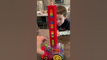 Kai and Reo watch domino train