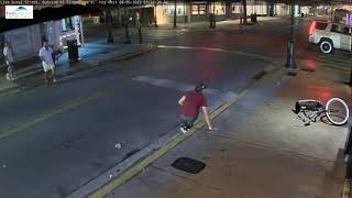 bicycle guy, looking the wrong way, runs into wall and topples over